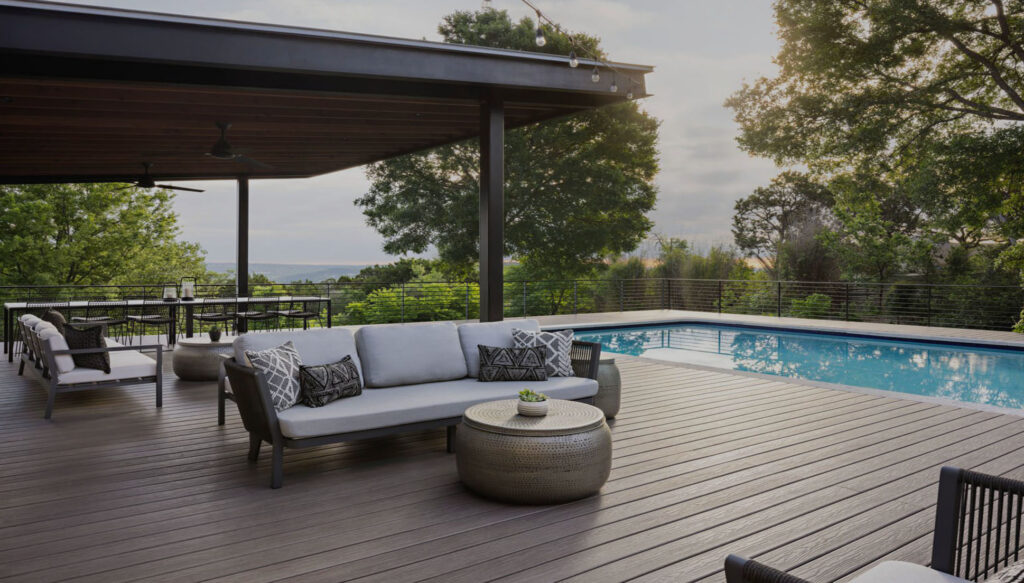 Homeowner reviewing custom deck plans with a contractor in London, Ontario
